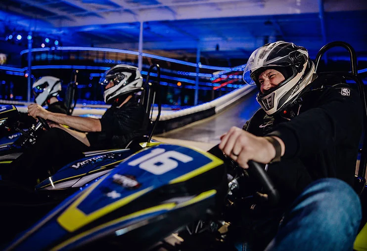 A driver smiling in a SODI RSX2 kart at Nitro City Racing Fairfield