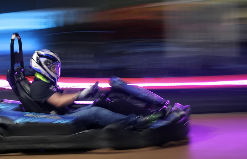A driver racing an OTL Superleggero kart at Nitro City Racing Rohnert Park