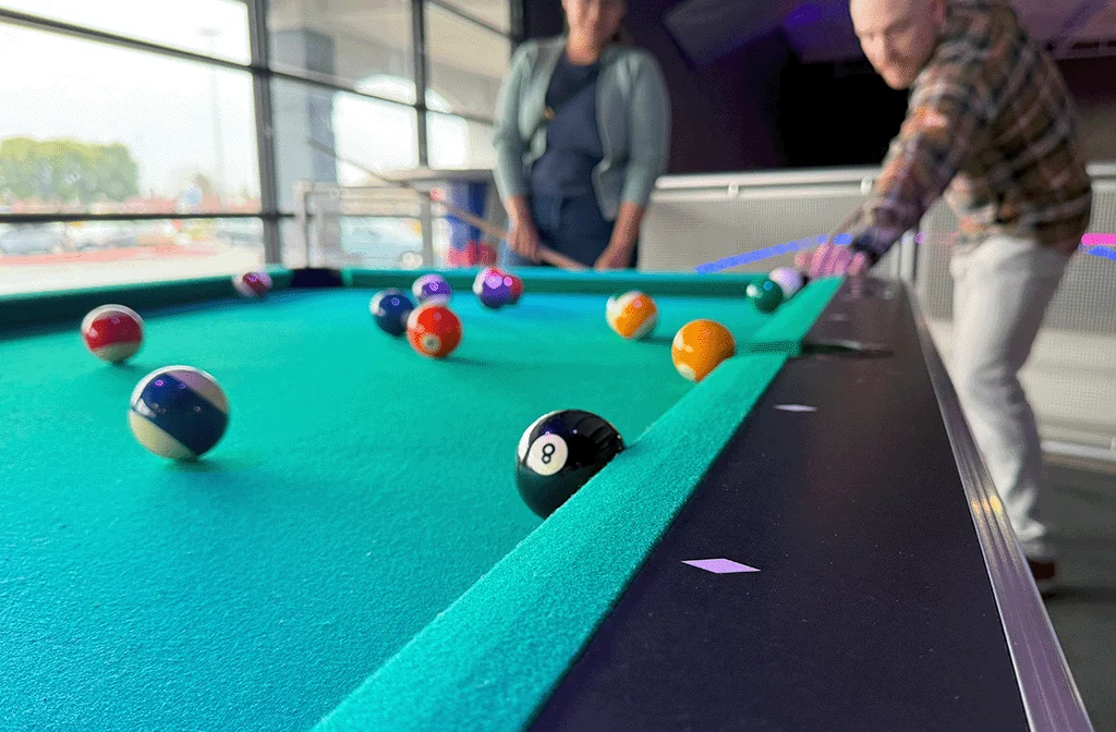 A pool table inside the Rohnert Park arcade area at Nitro City Racing