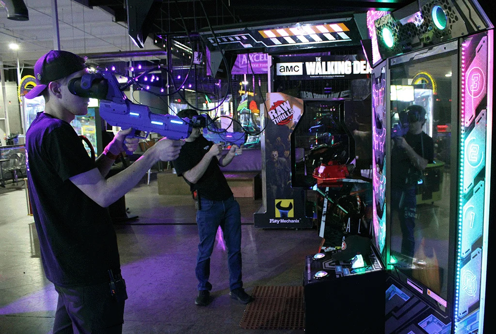 A guest playing a virtual reality arcade game at Nitro City Racing Rohnert Park