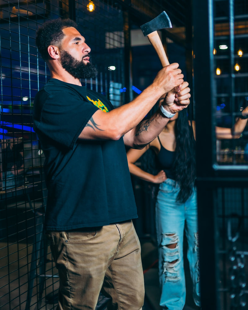A thrower winding up in an axe lane at Nitro City Racing