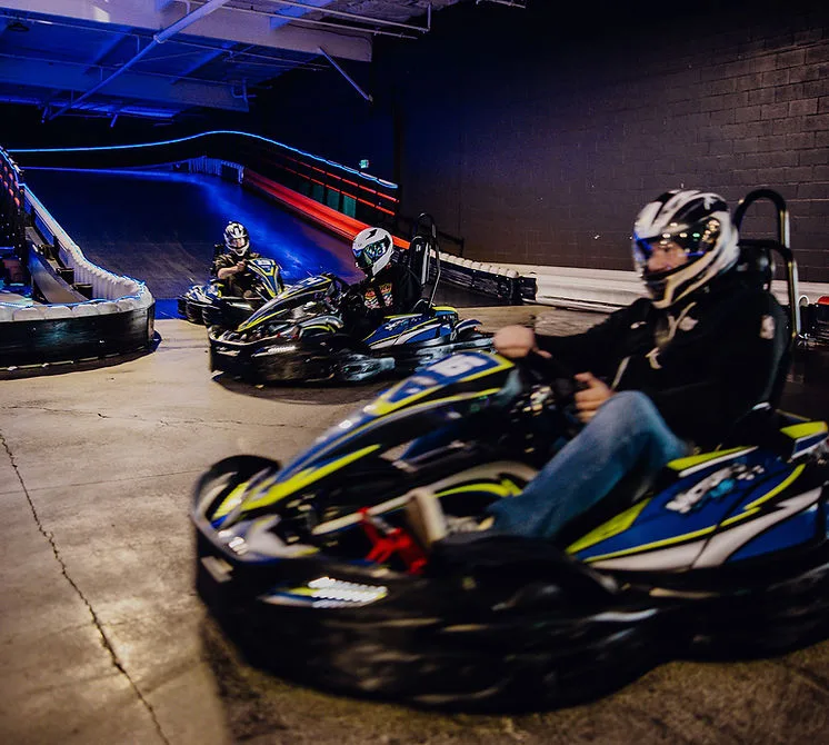 Guests racing go-karts indoors at Nitro City Racing Fairfield