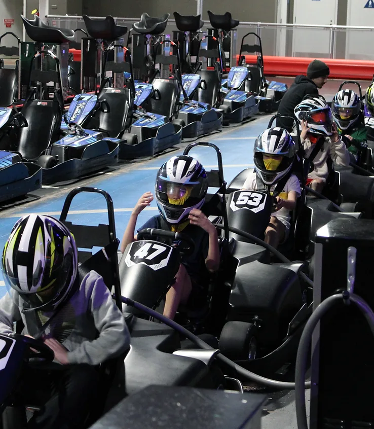 Go-karts racing through a corner during a timed session at Nitro City Racing Rohnert Park